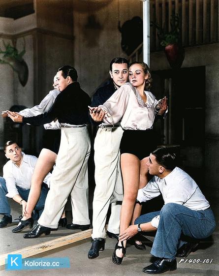 [colorized] George Raft and Carole Lombard get instructions from Paramount choreographer Leroy Prinz for dancing in BOLERO (1934).