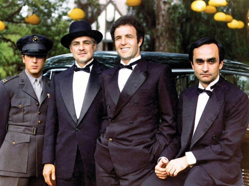 [colorized] Al Pacino, Marlon Brando, James Caan and John Cazale during a break from filming The Godfather (1972)