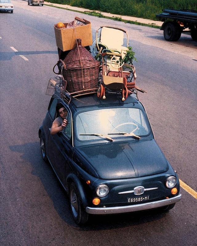 [colorized] A family going on the summer holiday in a Fiat 500 in Italy, 1967.