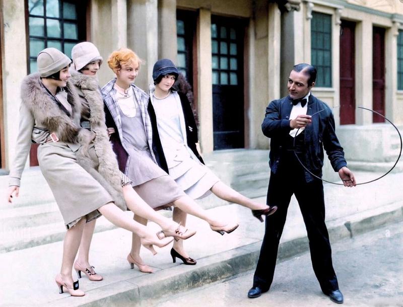 [colorized] Louise, Nancy Phillips, Josephine Dunn and Doris Hill get their kicks on the set of Rolled Stockings (1927) as James Hall looks on.