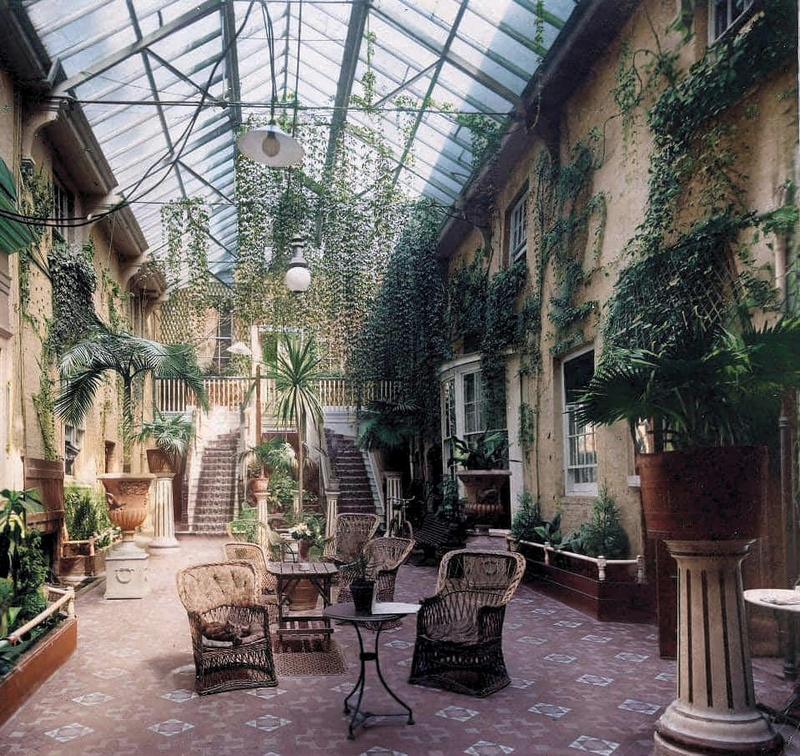 [colorized] A photograph of The Palm Court in the George Hotel, Winchester in 1902. 
The George stood on the corner of High Street and Jewry Street until it was demolished in 1956.