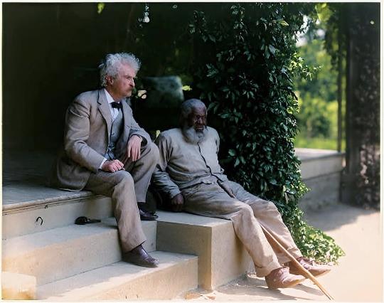 [colorized] Mark Twain with John Lewis, a lifelong friend and inspiration for the character Jim in Adventures of Huckleberry Finn, 1903.