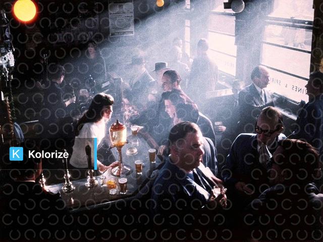 [colorized] A photograph of the inside of a Pub in Soho, taken in 1955.