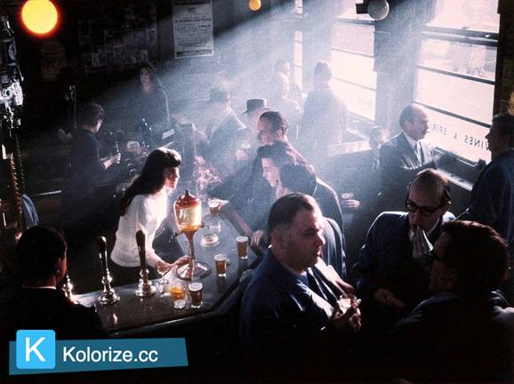 [colorized] A photograph of the inside of a Pub in Soho, taken in 1955.