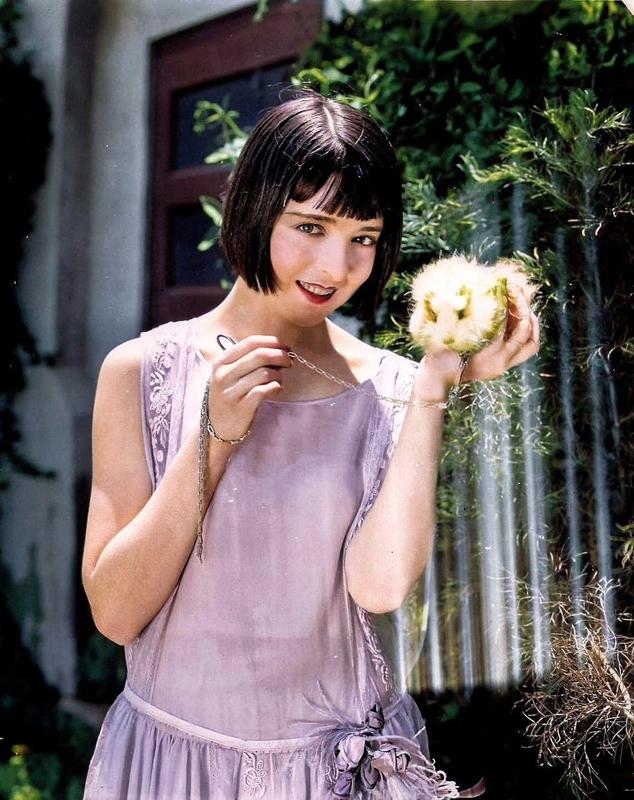 [colorized] Colleen Moore shows off her newly gifted guinea pig, 1924.