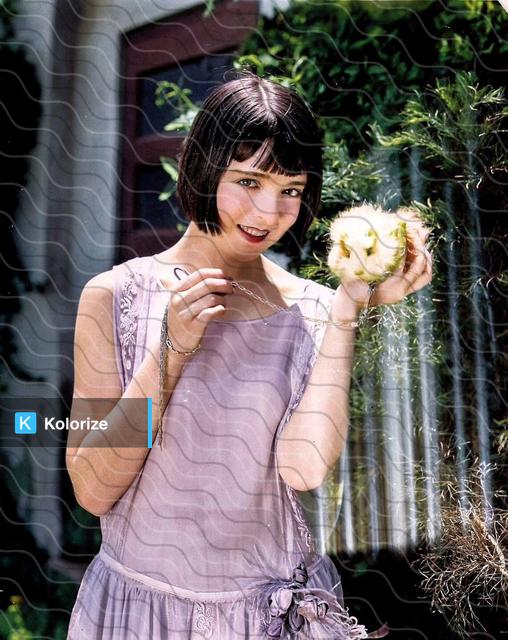 [colorized] Colleen Moore shows off her newly gifted guinea pig, 1924.