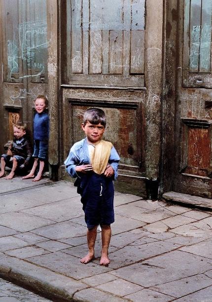 [colorized] A photograph of an East End child, London, in 1926.
