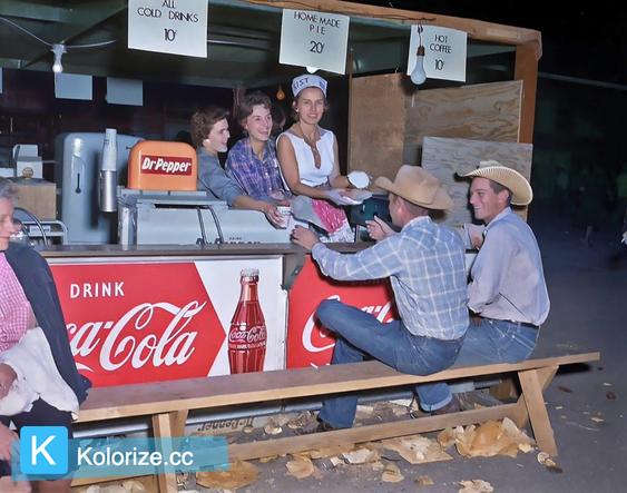 [colorized] Cowboys enjoy the food at the West Texas Fair in Abilene, 1957