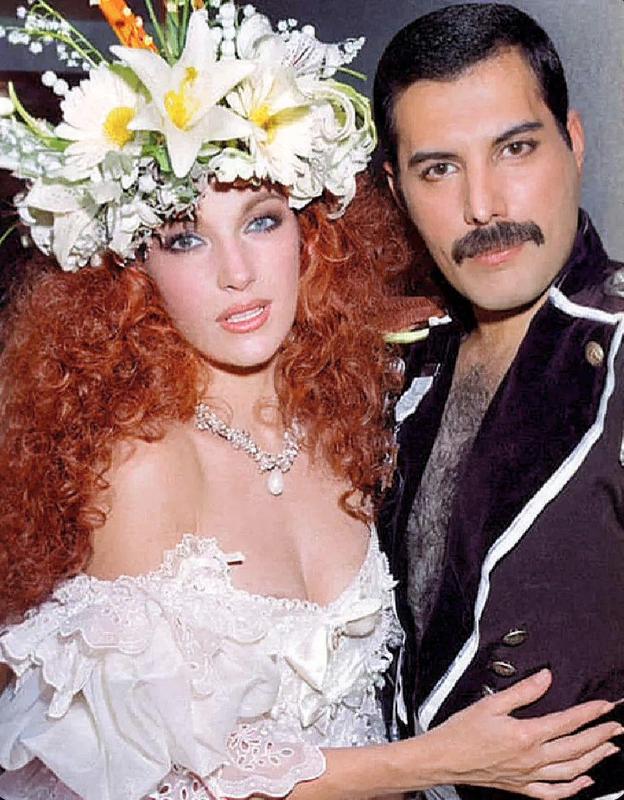 [colorized] Jane Seymour with Freddie Mercury at Fashion Aid, 1985