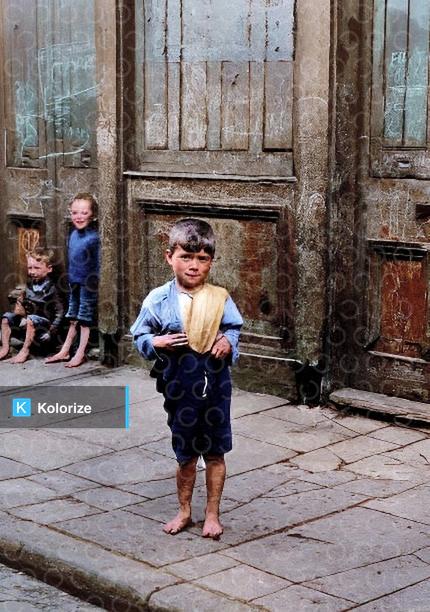 [colorized] A photograph of an East End child, London, in 1926.