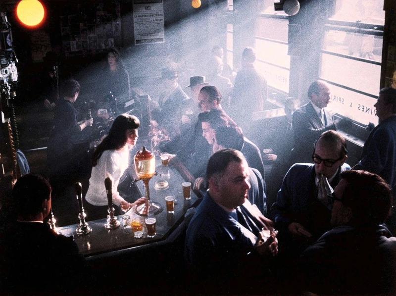 [colorized] A photograph of the inside of a Pub in Soho, taken in 1955.