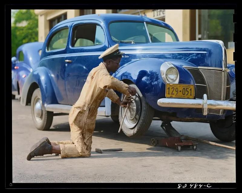 [colorized] Washington D.C. Changing a tire. Photo by John Collier, May 1942