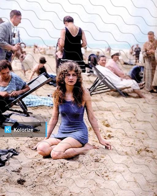 [colorized] Female swimmer posing on the beach. 1925.