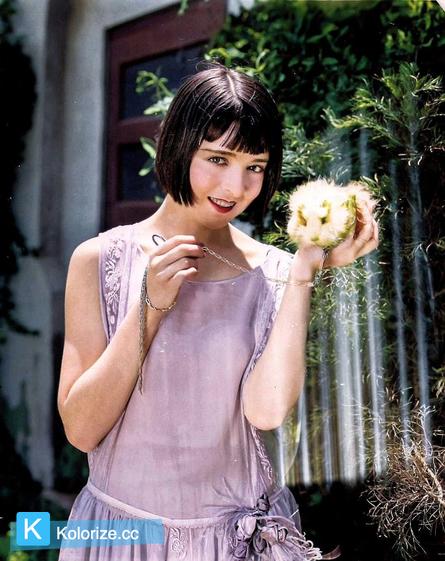 [colorized] Colleen Moore shows off her newly gifted guinea pig, 1924.