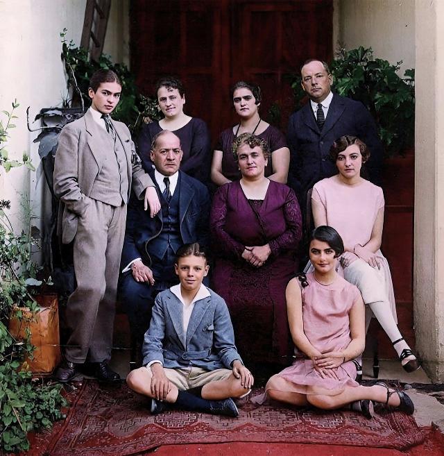 [colorized] A 17-year old Frida Kahlo poses for a family photo wearing a traditional gentleman's 3-piece suit, 1924.
